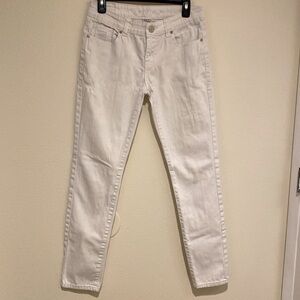 NV brand jeans. White slim fit below the waist. Worn look.
